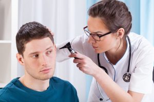 Why do ear infections often occur with a cold or the flu?